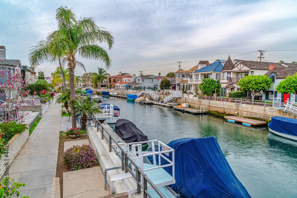 Waterfront houses boats and canal in dreamy Long Beach California neighborhood