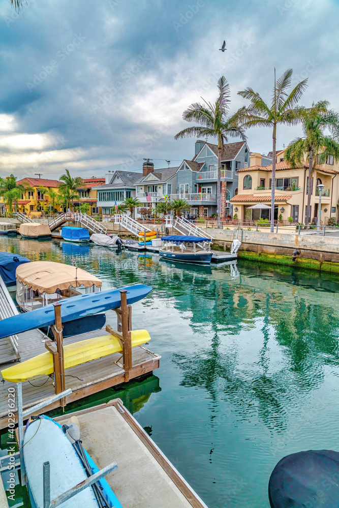 Duffy boats docked on the canal along elegant houses in Long Beach California