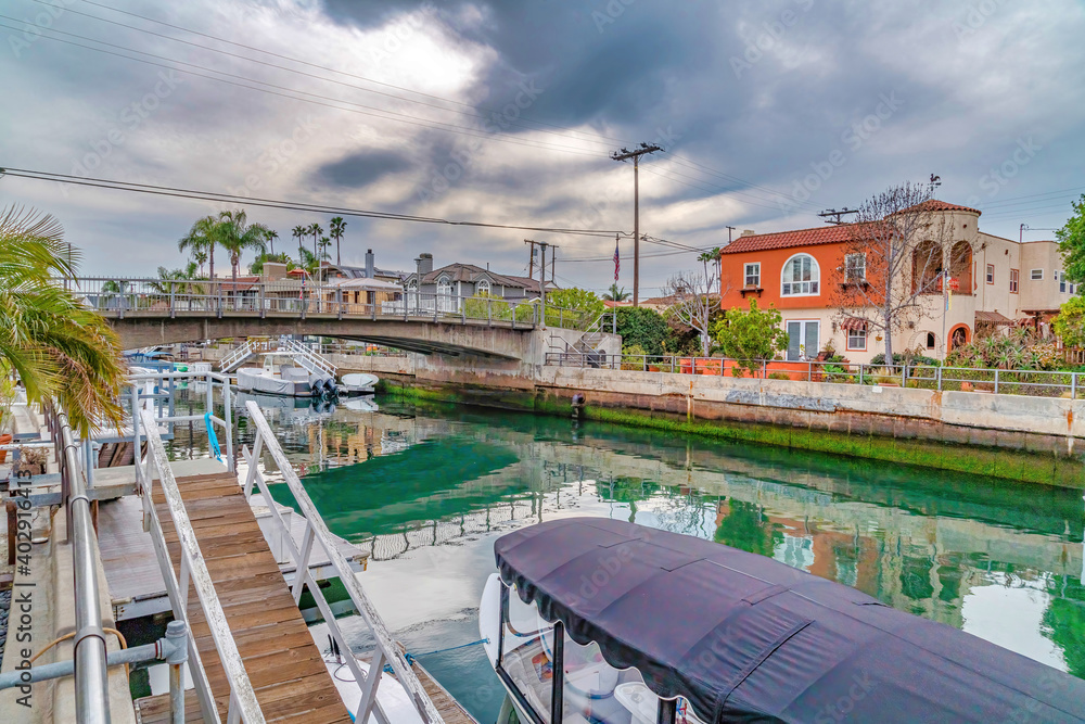 Beautiful canal with walkways and footbridge in scenic Long Beach California