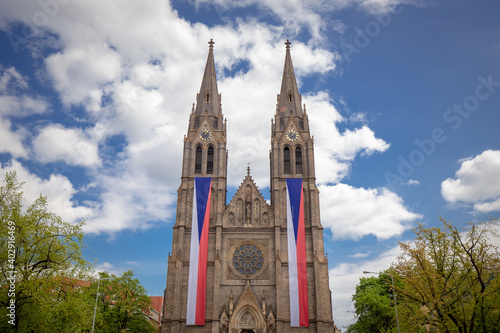Church of saint Ludmila on Namesti Miru  Peace Square  with Czech flags  in Prague  Czech Republic  Czechia   Europe