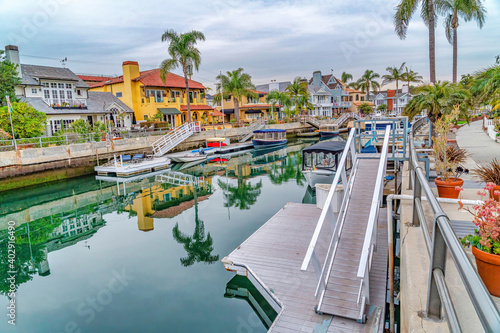Canal and boats along houses in dreamy coastal town of Long Beach California