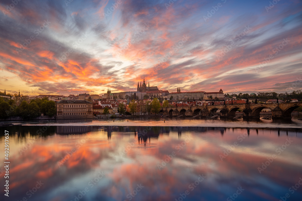 View on Charles Bridge and Prague Castle over Vltava River during early night with wonderful dusk sunset sky, Czechia, Europe