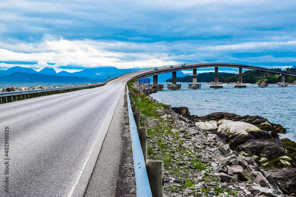Road 64 to Bolsoy Bridge or Bolsoybrua that crosses the Bolsoysund strait between mainland and island of Bolsoya.  Norway.