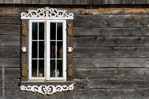 Wooden window background. Rustic cottage house wall. Vintage cabin white paint shutters. Countryside architecture texture.
