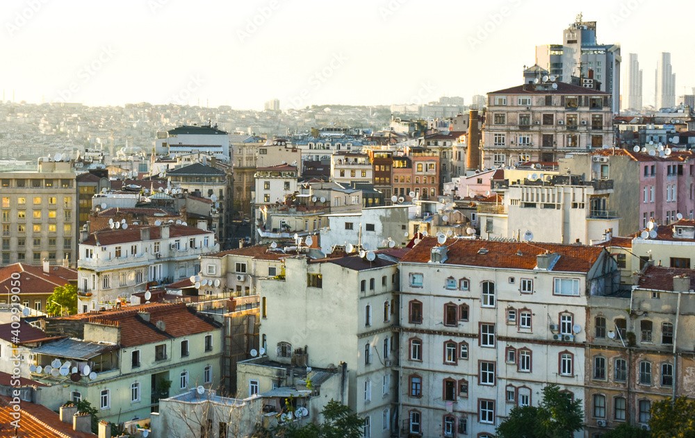 Urban crowded city landscape in Istanbul. View so many apartments with red roof and mosques