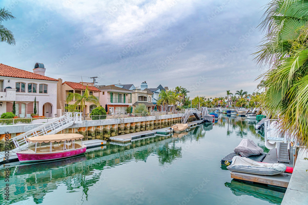Coastal community in Long Beach California with boats and docks on the canal
