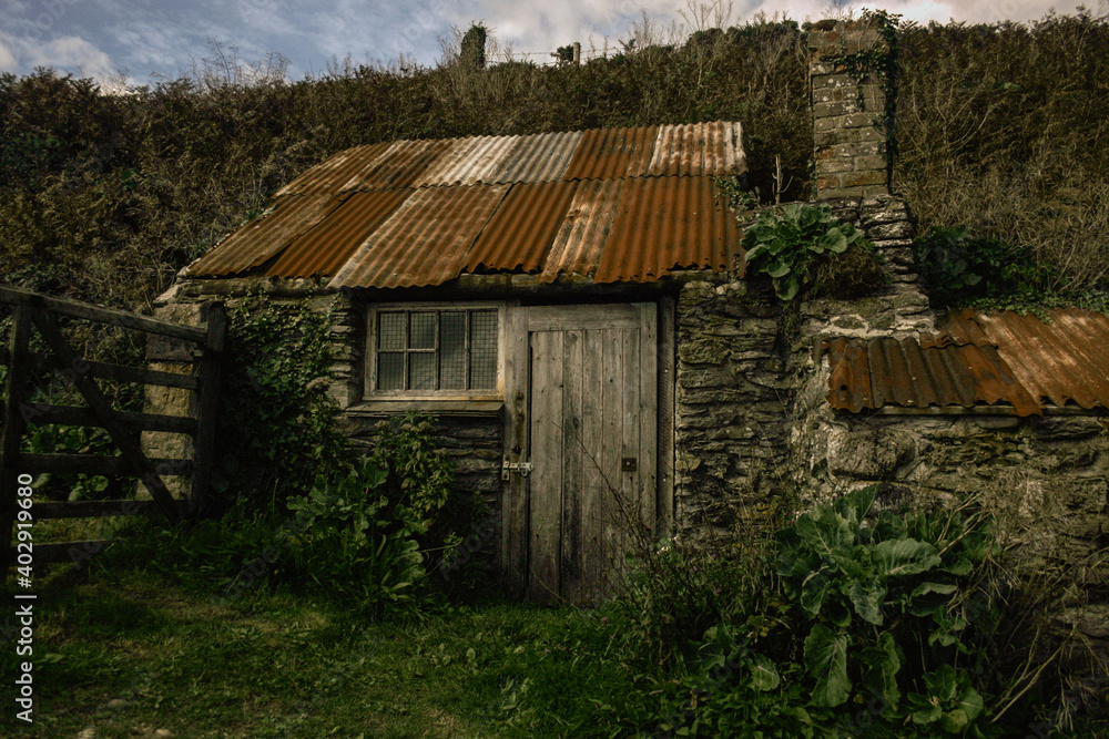 Old Fishermans hut in Cornwall. Almost derelict with rusty corrugated iron roof and salt water worn wood. Old Fishermans hut in Cornwall. Almost derelict with rusty corrugated iron roof and salt water worn wood.