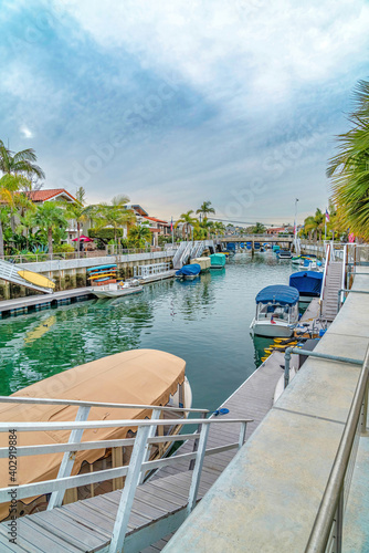 Long Beach California scenery with stairs boats and docks at the scenic canal