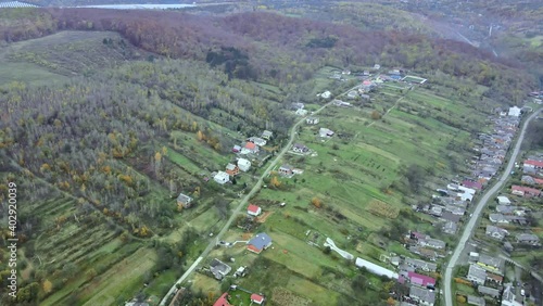 Aerial top dow view over suburb area village near mountain high altitude aerial top down view over countryside of Karpaty photo