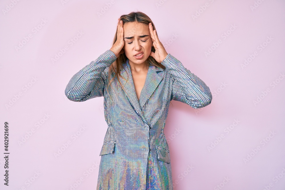 Young beautiful blonde woman wearing business jacket suffering from headache desperate and stressed because pain and migraine. hands on head. Young beautiful blonde woman wearing business jacket suffering from headache desperate and stressed because pain and migraine. hands on head.