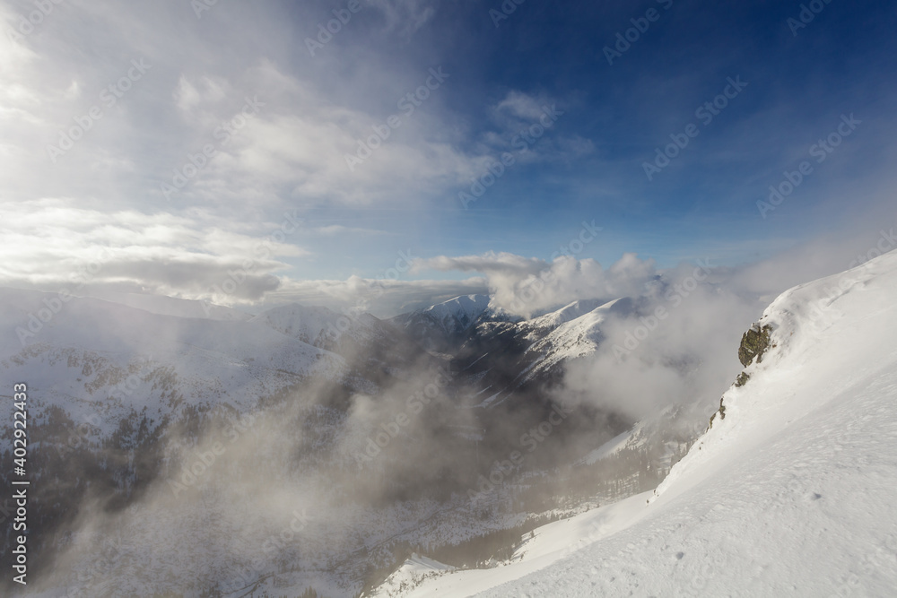 Low clouds over Tatry mountains during winter, Poland Low clouds over Tatry mountains during winter, Poland