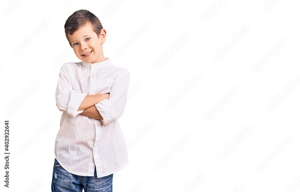 Cute blond kid wearing elegant shirt happy face smiling with crossed arms looking at the camera. positive person. Cute blond kid wearing elegant shirt happy face smiling with crossed arms looking at the camera. positive person.