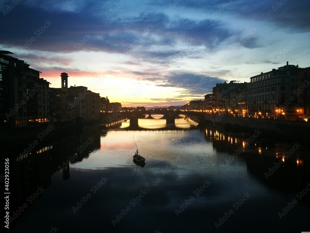sunset over the river arno