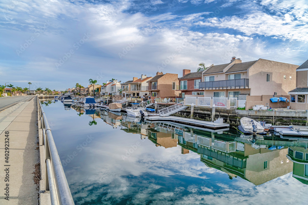Huntington Beach California scenery with homes overlooking the road and canal