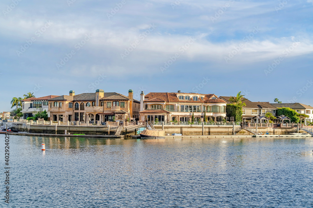 Luxury houses with private docks and view of the sea in Huntington Beach CA