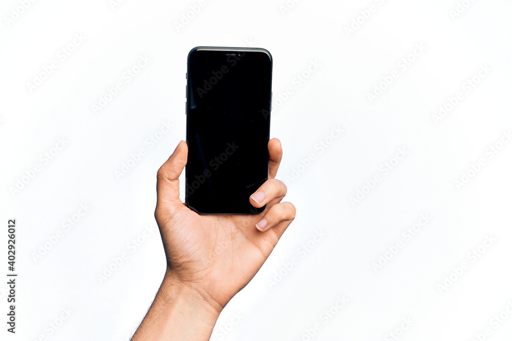 Hand of caucasian young man holding smartphone showing screen over isolated white background Hand of caucasian young man holding smartphone showing screen over isolated white background