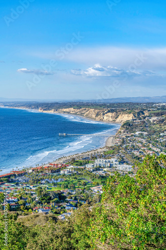 San Diego California coast bordered by scenic blue ocean against vast cloudy sky