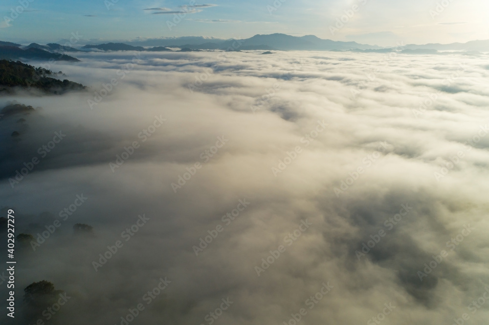Obraz premium Amazing scenery Nature landscape nature view Aerial view drone camera photography of Mist or fog flowing on Mountain peak in the morning sunrise or sunset At Khao Khai Nui Phang Nga Thailand