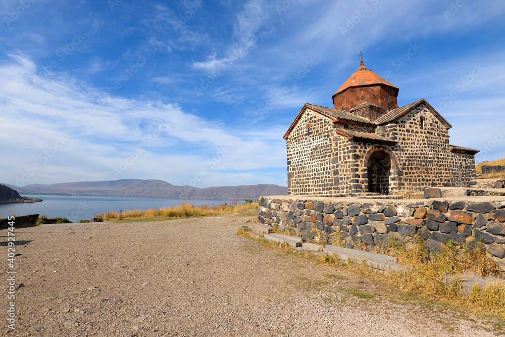 Sevan Monastery on the peninsula in Lake Sevan, Armenia and Holy Apostles Church (Surp Arakelot). Armenian Orthodox Apostolic Church near alpine lake. Sevan Monastery on the peninsula in Lake Sevan, Armenia and Holy Apostles Church (Surp Arakelot). Armenian Orthodox Apostolic Church near alpine lake.