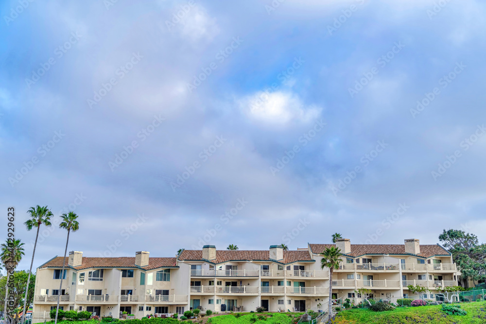Residential houses with clouds and blue sky background in San Diego California
