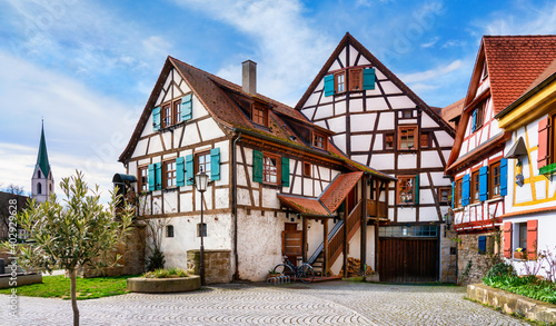 Church and half-timbered house in Rottenburg am Neckar on a sunny day in spring. Black forest, Germany