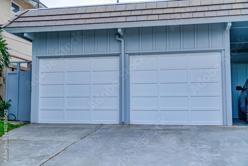 Two door garage and carport of house in San Diego California neighborhood
