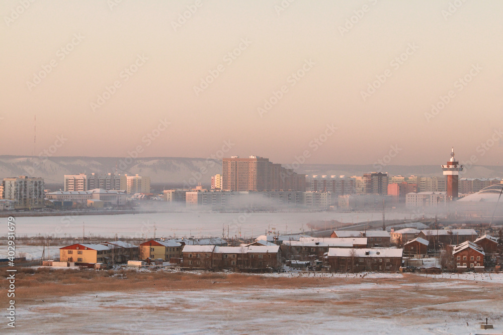 Winter frozen fog over Yakutsk, the capital of Sakha (Yakutia) Republic at sunset
