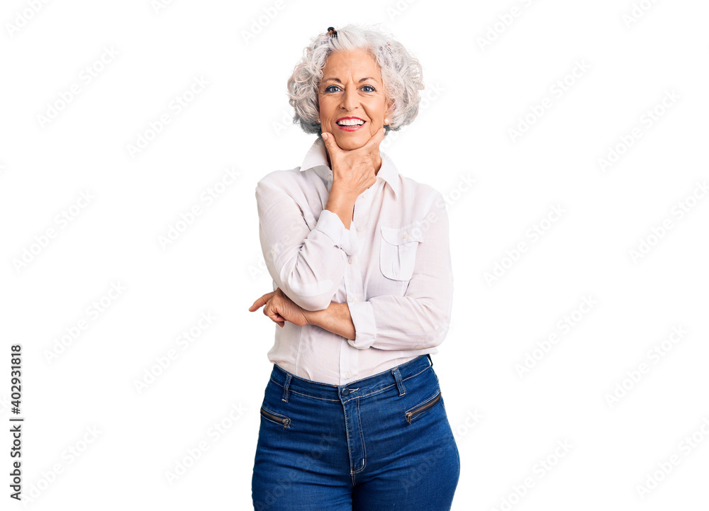 Senior grey-haired woman wearing casual clothes looking confident at the camera smiling with crossed arms and hand raised on chin. thinking positive. Senior grey-haired woman wearing casual clothes looking confident at the camera smiling with crossed arms and hand raised on chin. thinking positive.