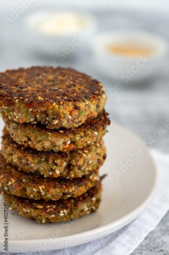 Healthy vegan gluten free veggie fritters stacked on top of each other