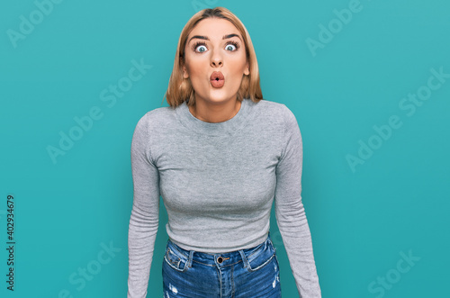 Young caucasian woman wearing casual clothes scared and amazed with open mouth for surprise, disbelief face