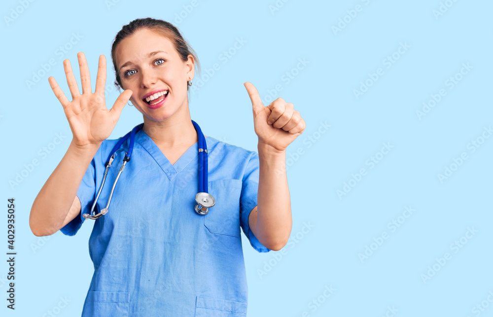 Young beautiful blonde woman wearing doctor uniform and stethoscope showing and pointing up with fingers number six while smiling confident and happy. Young beautiful blonde woman wearing doctor uniform and stethoscope showing and pointing up with fingers number six while smiling confident and happy.