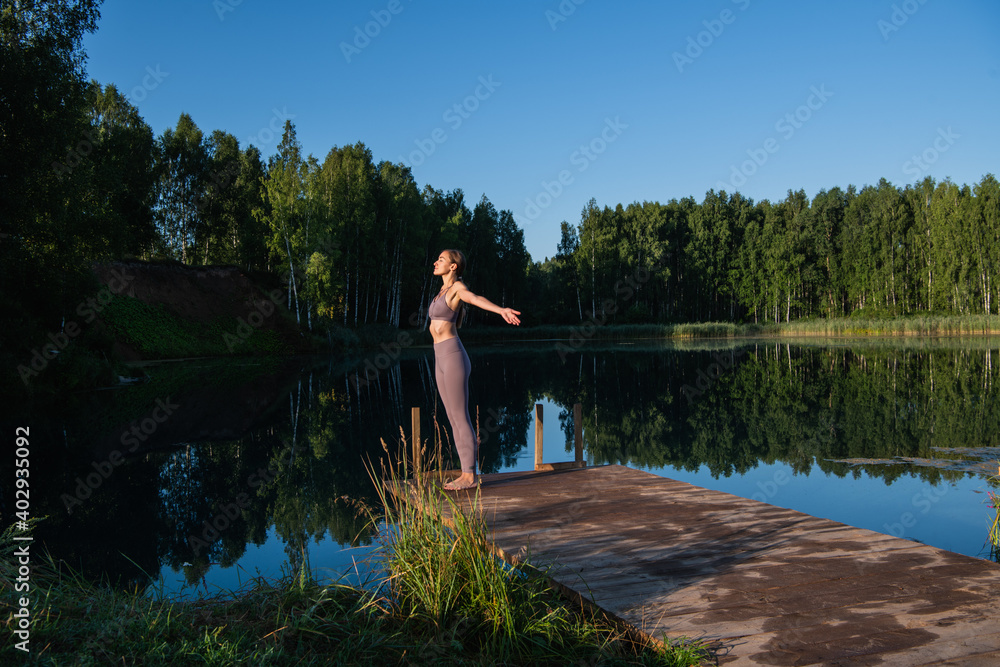 Calm young woman taking deep breath of fresh air relaxing meditating enjoying peace, serene tranquil girl doing yoga exercise feel no stress free relief Calm young woman taking deep breath of fresh air relaxing meditating enjoying peace, serene tranquil girl doing yoga exercise feel no stress free relief