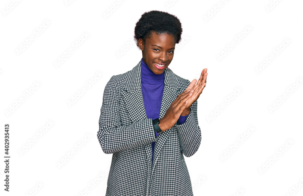 Young african american girl wearing casual clothes clapping and applauding happy and joyful, smiling proud hands together Young african american girl wearing casual clothes clapping and applauding happy and joyful, smiling proud hands together