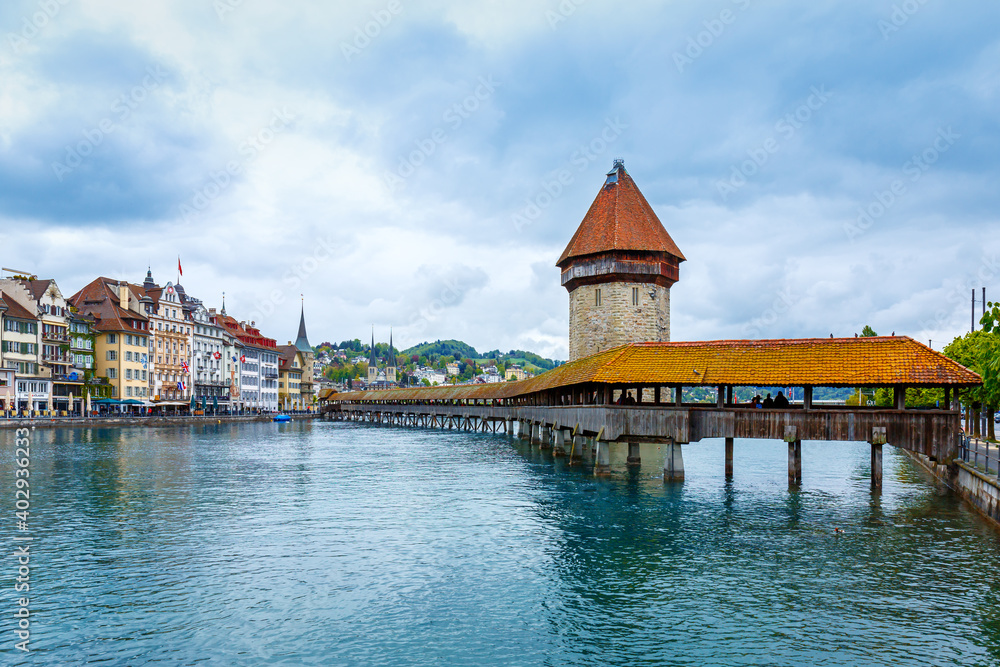 Historic city center of Lucerne with  Chapel Bridge and lake Lucerne in cloudy day, Switzerland
