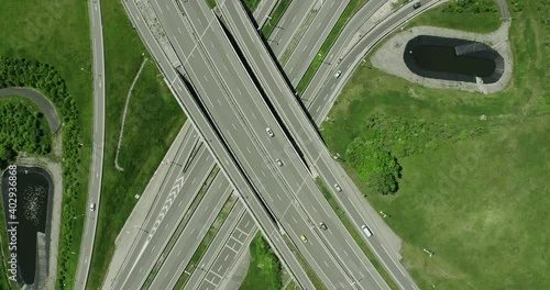 Drone aerial of Truck driving through motorway with green forest lake and mountains alps in the background summer 7 photo