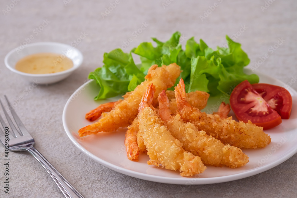 Fried breaded shrimp with vegetable on plate and plum sauce Fried breaded shrimp with vegetable on plate and plum sauce