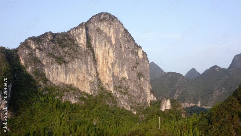 Beautiful karst mountain rock face in remote Chinese countryside, aerial view Beautiful karst mountain rock face in remote Chinese countryside, aerial view
