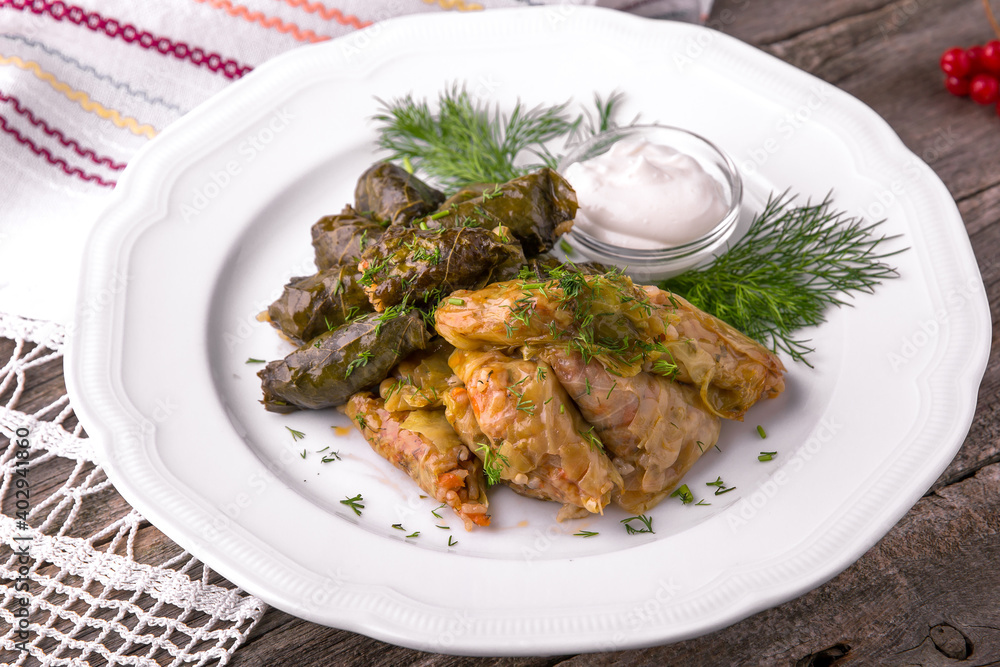 Dolma. Cabbage rolls. Rolls of rice with meat and vegetables wrapped in grape and cabbage leaves. Balkan cuisine. National cuisine. Nourishing, useful, natural. Rustic cuisine. Dolma. Cabbage rolls. Rolls of rice with meat and vegetables wrapped in grape and cabbage leaves. Balkan cuisine. National cuisine. Nourishing, useful, natural. Rustic cuisine.