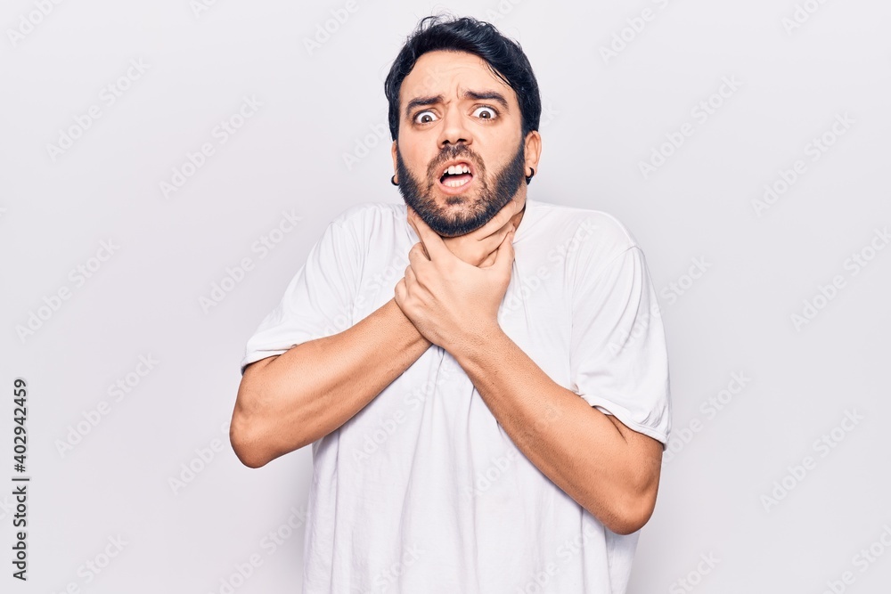 Young hispanic man wearing casual clothes shouting and suffocate because painful strangle. health problem. asphyxiate and suicide concept. Young hispanic man wearing casual clothes shouting and suffocate because painful strangle. health problem. asphyxiate and suicide concept.