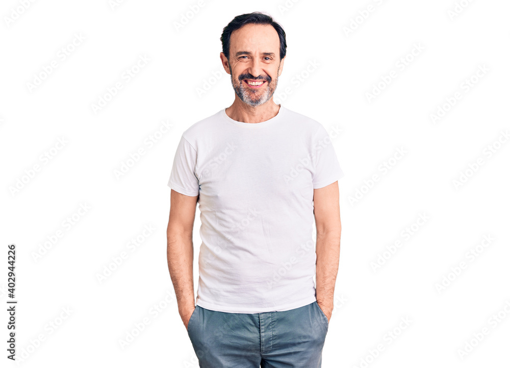 Middle age handsome man wearing casual t-shirt with a happy and cool smile on face. lucky person. Middle age handsome man wearing casual t-shirt with a happy and cool smile on face. lucky person.