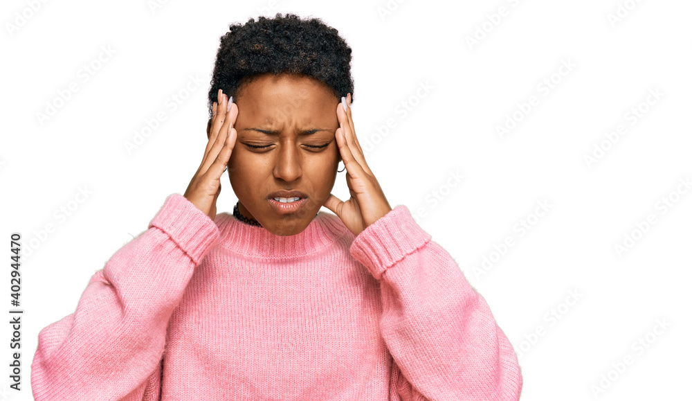 Young african american woman wearing casual clothes with hand on head for pain in head because stress. suffering migraine. Young african american woman wearing casual clothes with hand on head for pain in head because stress. suffering migraine.
