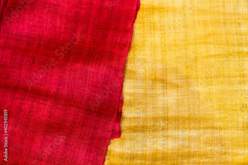 Abstract blurred red and yellow hemp fabric background, nature fiber fabric