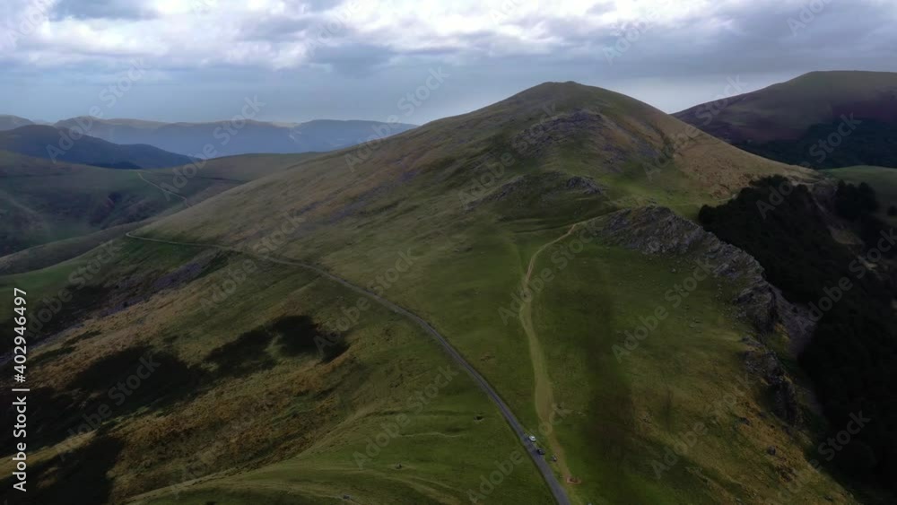 Drone aerial shot of the Pyrenees in mid summer flying over a small track Drone aerial shot of the Pyrenees in mid summer flying over a small track