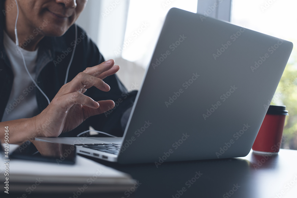 Man making video calling using zoom online meeting app during working on laptop computer from home Man making video calling using zoom online meeting app during working on laptop computer from home