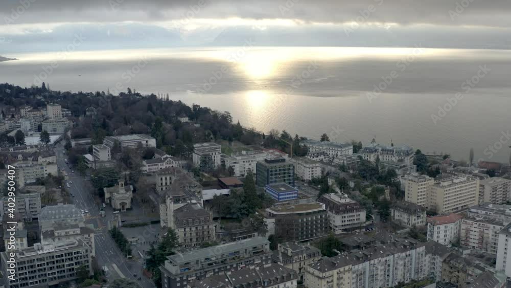 Drone Aerial of the beautiful swiss city center of lausanne located on the lake geneva (lac léman) in Switzerland during winter, Europe. Drone Aerial of the beautiful swiss city center of lausanne located on the lake geneva (lac léman) in Switzerland during winter, Europe.