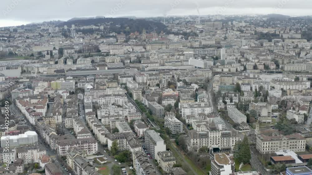 Drone Aerial of the beautiful swiss city center of lausanne located on the lake geneva (lac léman) in Switzerland during winter, Europe. Drone Aerial of the beautiful swiss city center of lausanne located on the lake geneva (lac léman) in Switzerland during winter, Europe.