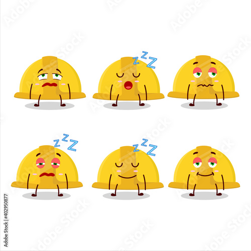 Cartoon character of yellow construction helmet with sleepy expression