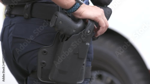 Holstered Gun on Police Woman Close Up 4K