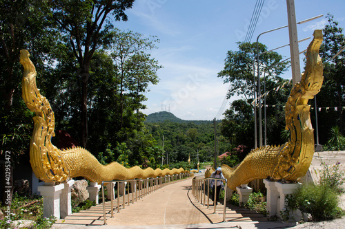 Naka statue entrance go to Big buddha on top of mountain for Thai people and travelers travel visit respect praying at Wat Doi Thep Sombun temple in Phu Phan mountain in Nong Bua Lamphu  Thailand
