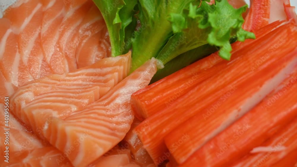 salad salmon sashimi and crab stick on plate, 4k rotating scene salad salmon sashimi and crab stick on plate, 4k rotating scene
